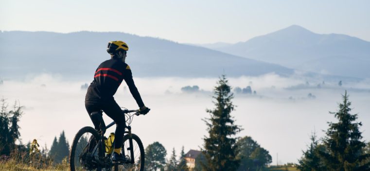 male-cyclist-riding-bicycle-mountains