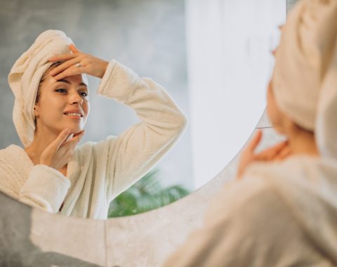 woman-home-applying-cream-mask